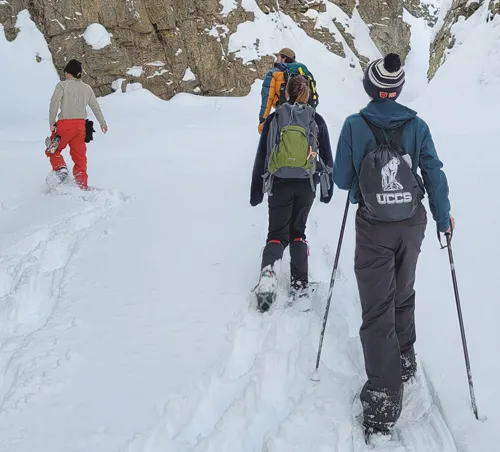 GES students conducting research in the field using skis